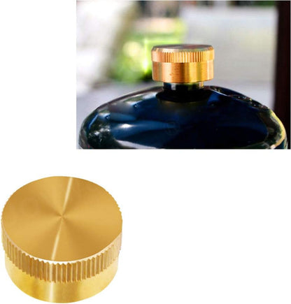 Close-up of a gold bottle cap on a blurred background